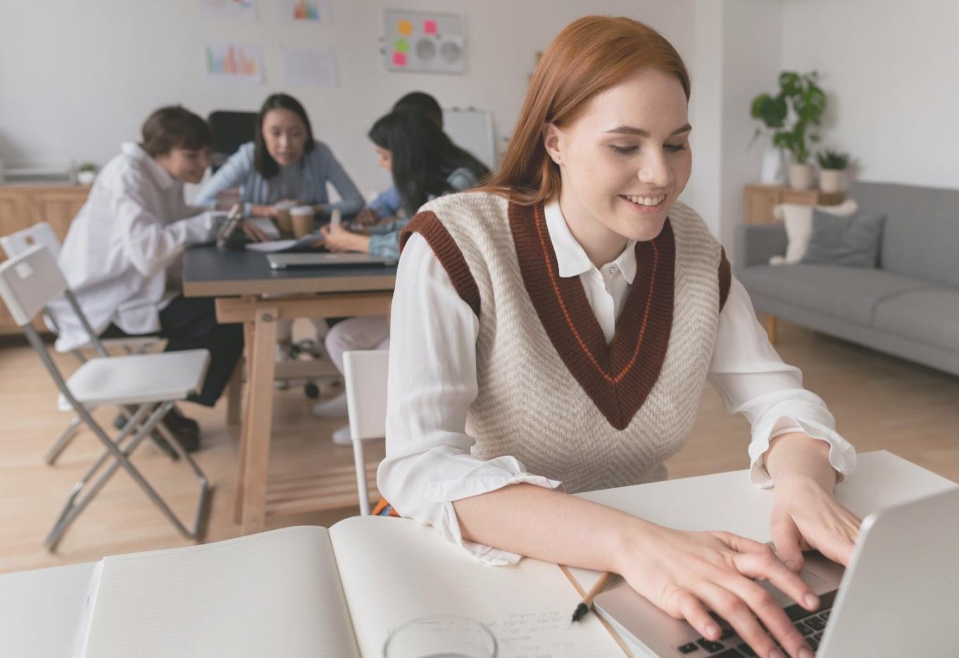 Financial charts and data analysis displayed on computer screens showing startup metrics